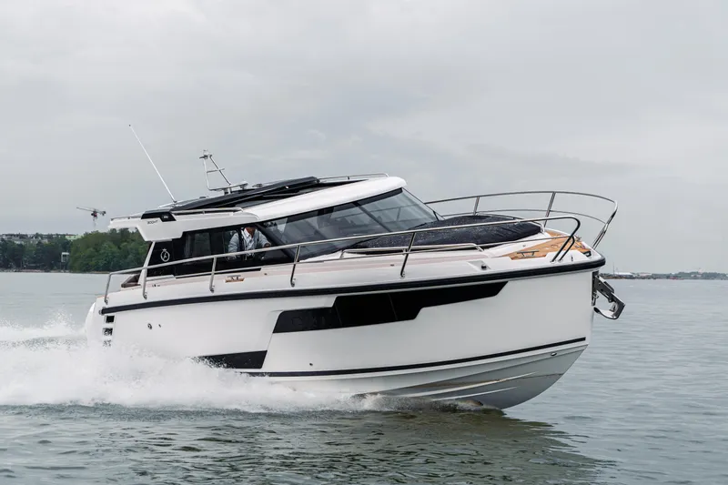 Slide: The Image of 2025 Aquador 300 HT cruising on water, sleek design, modern features. - 8