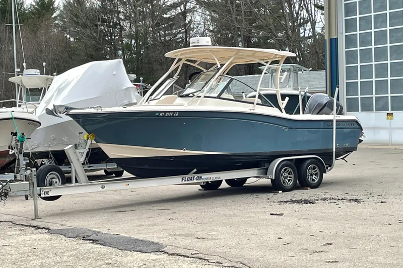 Slide: The Image of 2015 Grady White 255 Freedom boat on trailer, parked outdoors. - 8