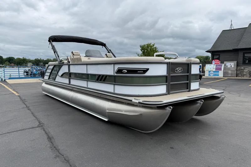 Slide: The Image of 2026 Bentley Pontoons Elite 253 Admiral on a dock under cloudy skies. - 10