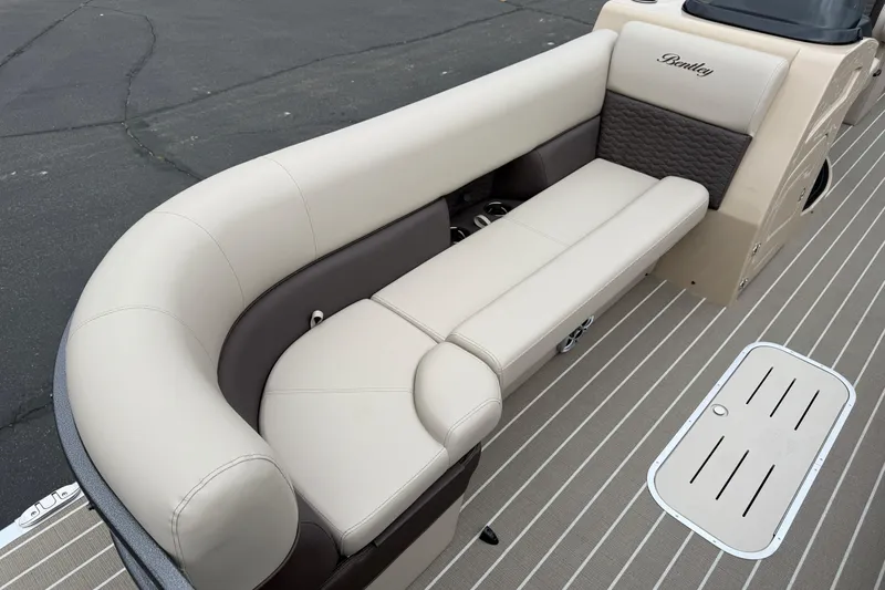 Slide: The Image of Luxurious seating on 2026 Bentley Pontoons Elite 253 Admiral, featuring elegant beige upholstery. - 13