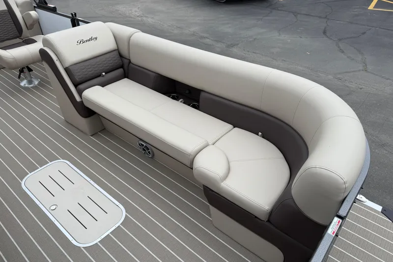 Slide: The Image of 2026 Bentley Pontoons Elite 253 Admiral, luxurious seating on a pontoon boat deck. - 14