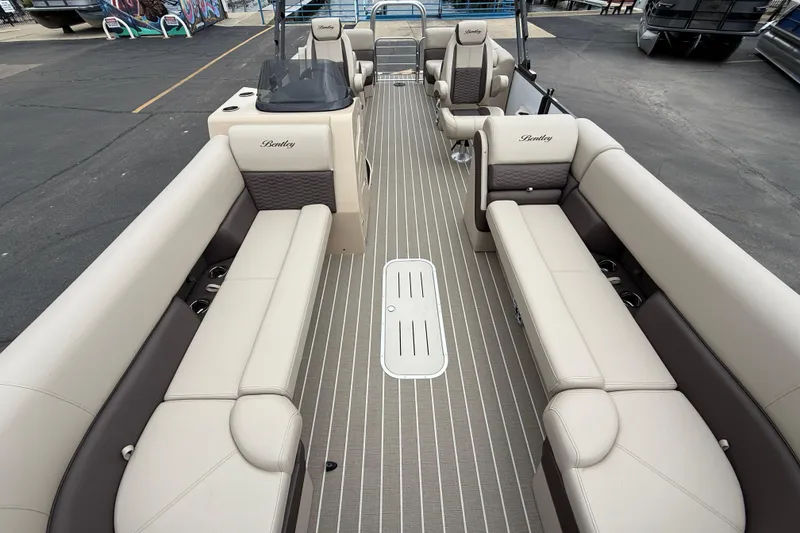 Slide: The Image of 2026 Bentley Pontoons Elite 253 Admiral interior with luxurious seating and modern design. - 16