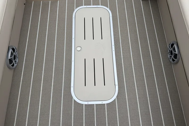 Slide: The Image of 2026 Bentley Pontoons Elite 253 Admiral deck with striped flooring and speaker details. - 17