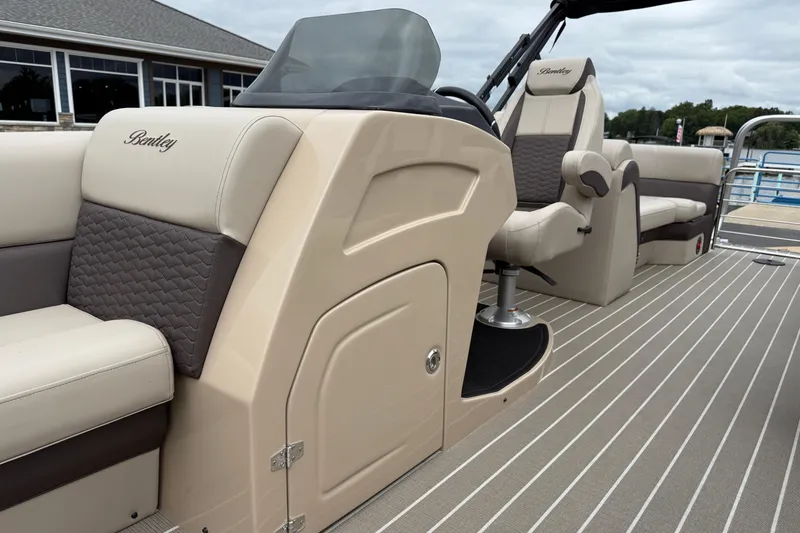 Slide: The Image of 2026 Bentley Pontoons Elite 253 Admiral interior with luxurious seating and modern design. - 18