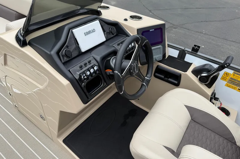 Slide: The Image of 2026 Bentley Pontoons Elite 253 Admiral dashboard with steering wheel and control panel. - 21