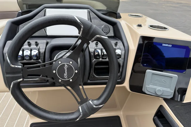 Slide: The Image of Steering console of 2026 Bentley Pontoons Elite 253 Admiral with Simrad display. - 22