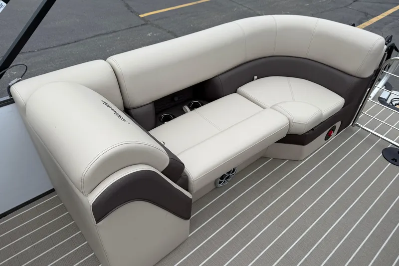 Slide: The Image of 2026 Bentley Pontoons Elite 253 Admiral, luxurious seating with beige and brown upholstery. - 29