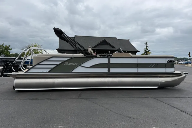 Slide: The Image of 2026 Bentley Pontoons Elite 253 Admiral pontoon boat parked outdoors. - 9