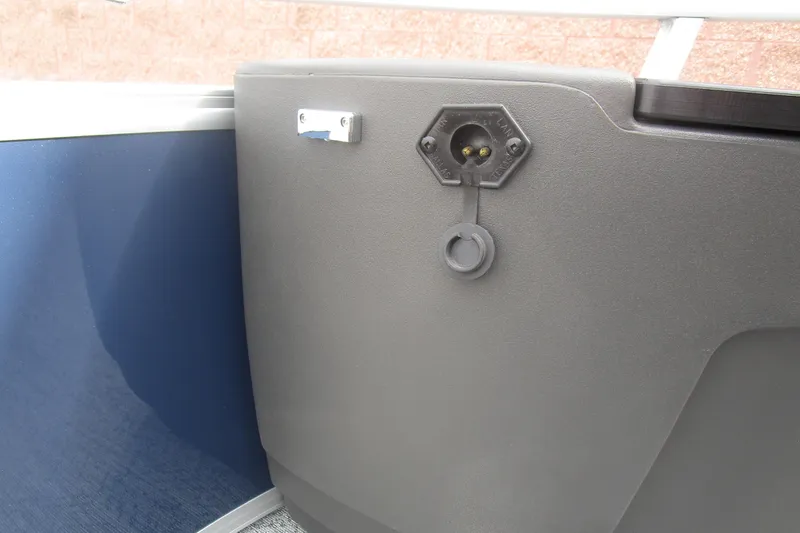 Slide: The Image of 2026 Sun Tracker Bass Buggy 18 DLX boat interior detail with power outlet. - 15