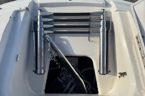 Slide: The Image of 2009 Sea Ray 230 Sundeck boat ladder and anchor storage compartment. - 23