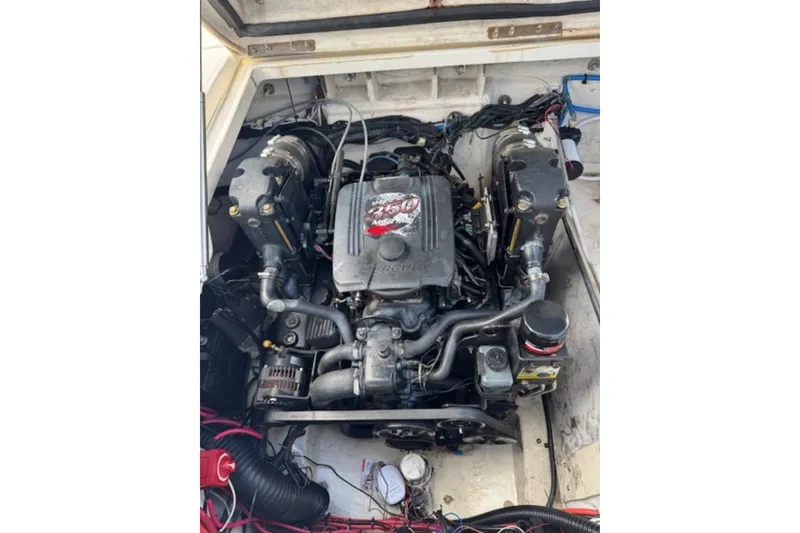 Slide: The Image of Engine compartment of a 2009 Sea Ray 230 Sundeck boat, showing detailed components. - 37