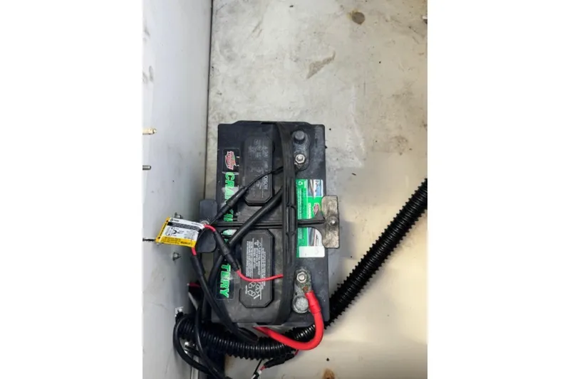 Slide: The Image of Battery compartment of a 2009 Sea Ray 230 Sundeck boat, showing wiring connections. - 38