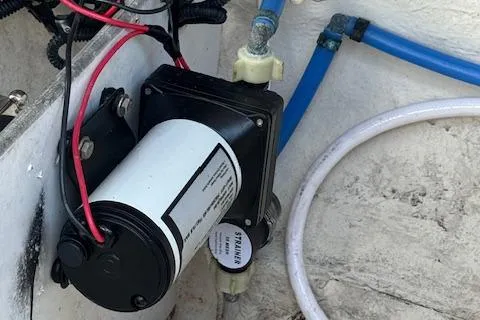 Slide: The Image of Boat pump system in a 2009 Sea Ray 230 Sundeck, featuring wiring and tubing. - 40