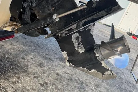 Slide: The Image of 2009 Sea Ray 230 Sundeck boat propeller with visible wear and corrosion. - 43