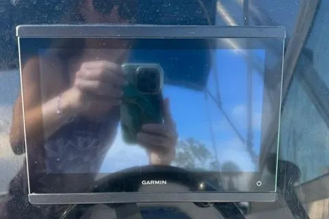 Slide: The Image of Garmin display on 2009 Sea Ray 230 Sundeck, reflecting a person taking a photo. - 9