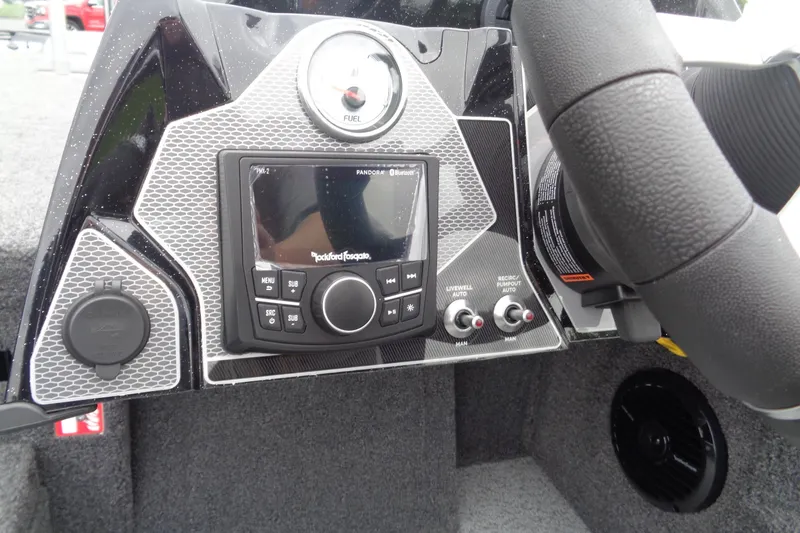 Slide: The Image of Dashboard of 2026 Lund 2075 Pro-V Bass XS boat with steering wheel and gauges. - 13