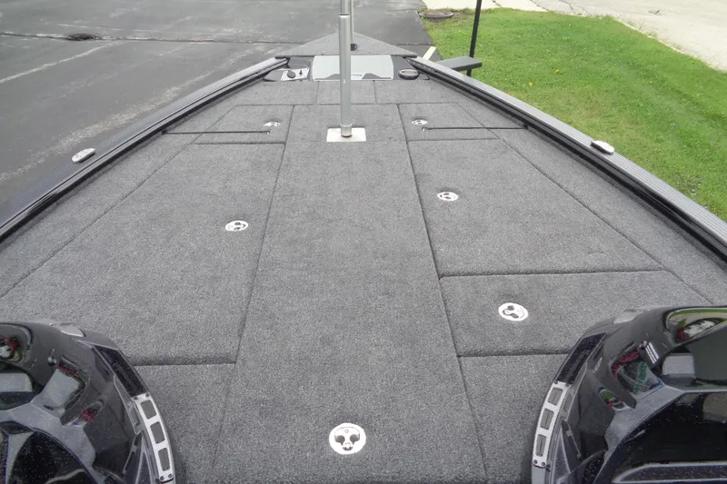 Slide: The Image of 2026 Lund 2075 Pro-V Bass XS boat interior with dual consoles and steering wheel. - 17