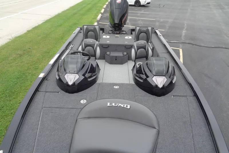 Slide: The Image of 2026 Lund 2075 Pro-V Bass XS boat deck with control panel and cup holder. - 20