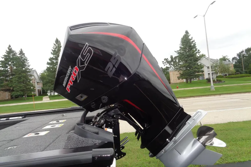 Slide: The Image of 2026 Lund 2075 Pro-V Bass XS boat on trailer, featuring sleek black and red design. - 3