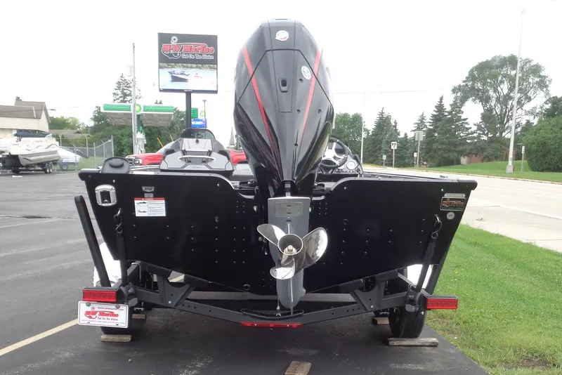 Slide: The Image of 2026 Lund 2075 Pro-V Bass XS with Mercury Pro XS 250 engine, parked outdoors. - 4