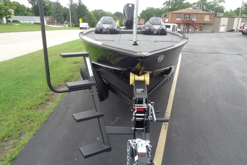 Slide: The Image of 2026 Lund 2075 Pro-V Bass XS boat on trailer in parking lot. - 8
