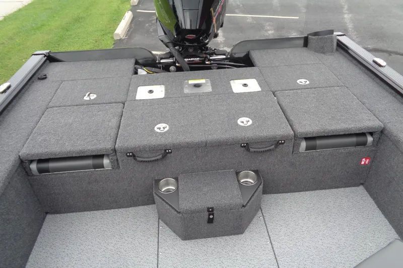 Slide: The Image of 2026 Lund 2075 Pro-V Bass XS boat on trailer, parked on asphalt. - 9