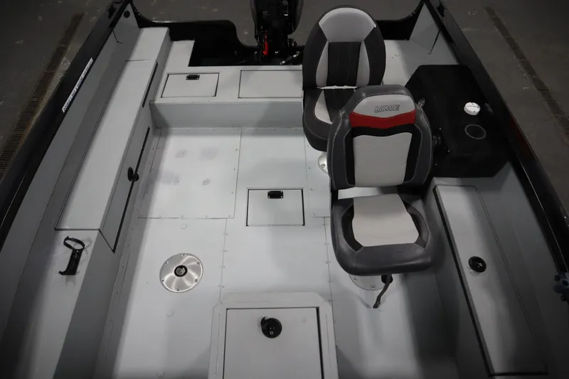 Slide: The Image of 2017 Lowe 1610 FM boat interior with seating and storage compartments. - 20