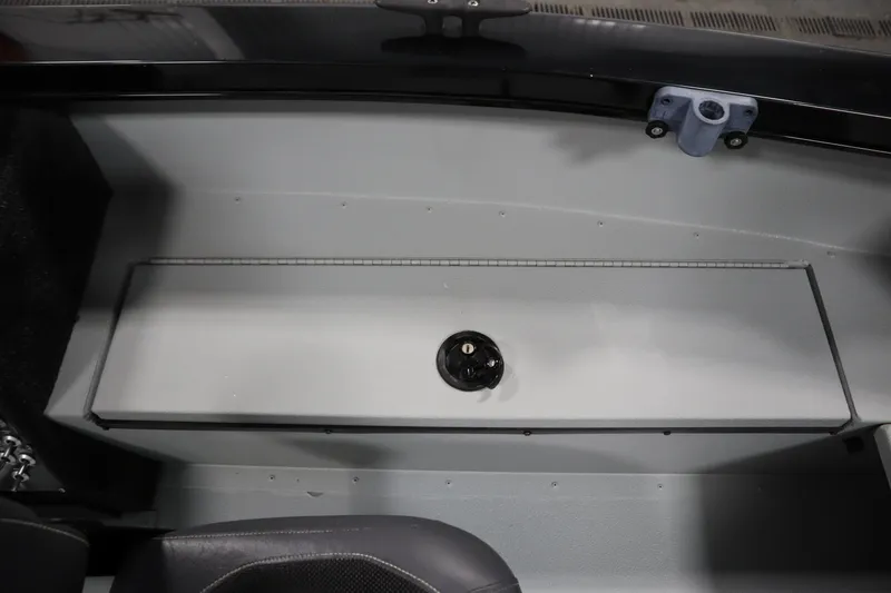 Slide: The Image of 2017 Lowe 1610 FM boat interior storage compartment with latch. - 21