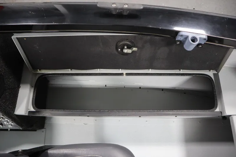 Slide: The Image of Open storage compartment in a 2017 Lowe 1610 FM boat. - 22