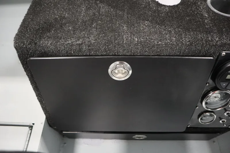 Slide: The Image of 2017 Lowe 1610 FM boat dashboard with black panel and gauges. - 25