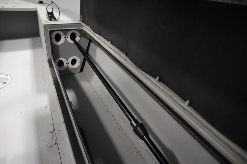 Slide: The Image of Interior view of a 2017 Lowe 1610 FM boat storage compartment. - 32