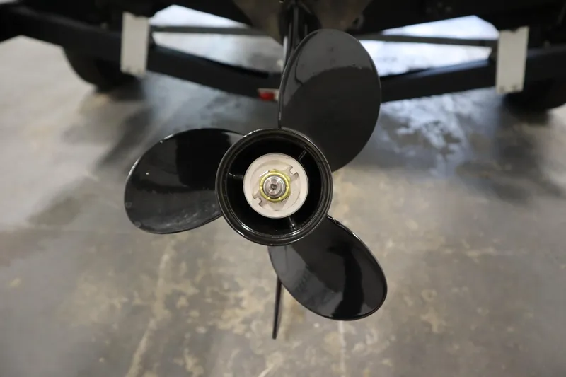 Slide: The Image of Close-up of a 2017 Lowe 1610 FM boat propeller on a concrete floor. - 40