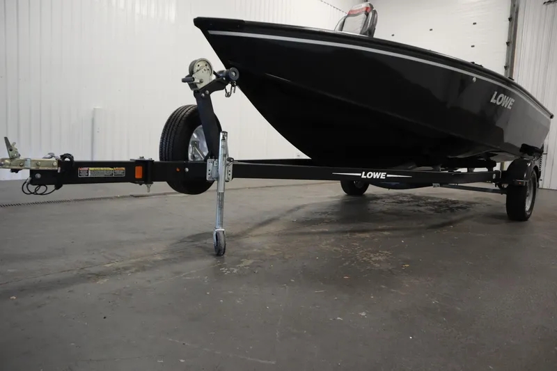Slide: The Image of 2017 Lowe 1610 FM boat on trailer in indoor storage facility. - 43