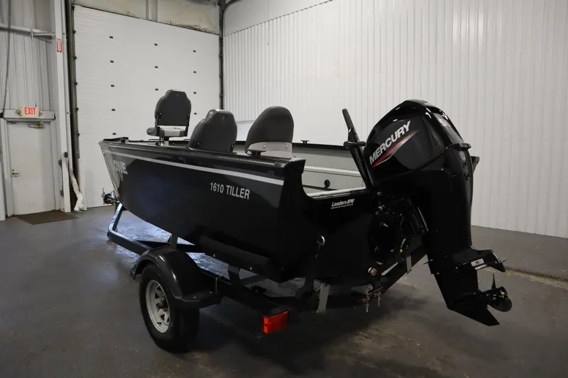 Slide: The Image of 2017 Lowe 1610 FM boat with Mercury engine in indoor storage. - 6