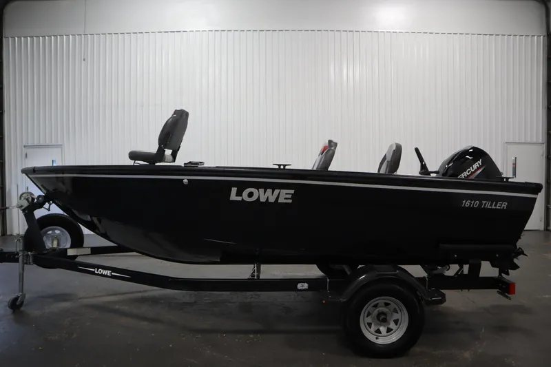 Slide: The Image of 2017 Lowe 1610 FM fishing boat on trailer in indoor setting. - 7