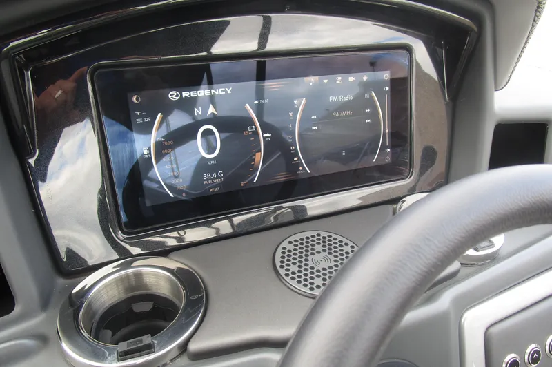 Slide: The Image of 2024 Regency 230 LE3 dashboard with digital display and controls. - 10