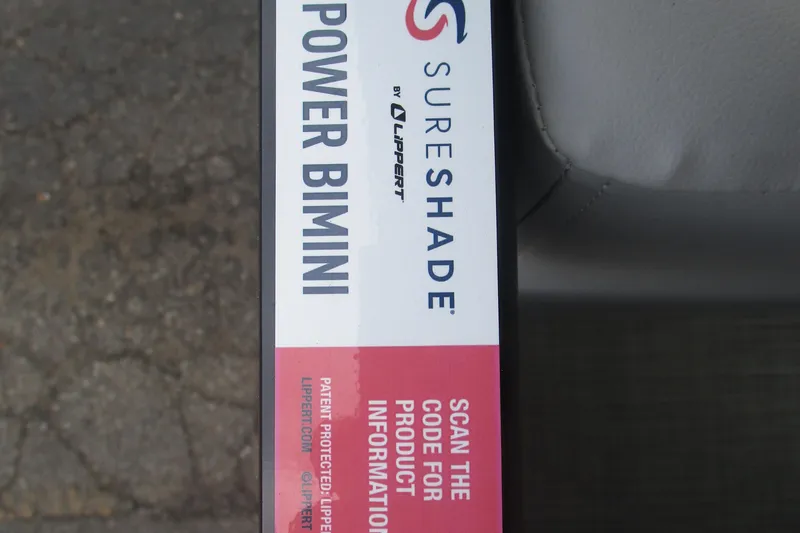 Slide: The Image of 2024 Regency 230 LE3 SureShade Power Bimini label with product information QR code. - 14
