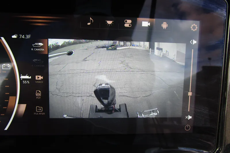 Slide: The Image of 2024 Regency 230 LE3 dashboard display showing rear camera view and controls. - 15