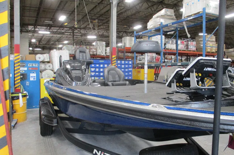 Slide: The Image of 2024 Nitro Z20 boat in warehouse, featuring advanced Lowrance electronics. - 11