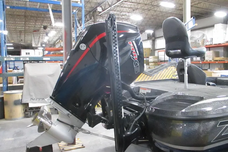 Slide: The Image of 2024 Nitro Z20 boat with powerful outboard motor in a warehouse setting. - 12