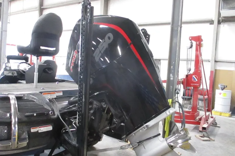 Slide: The Image of 2024 Nitro Z20 boat with powerful 250 Pro engine in a workshop setting. - 13