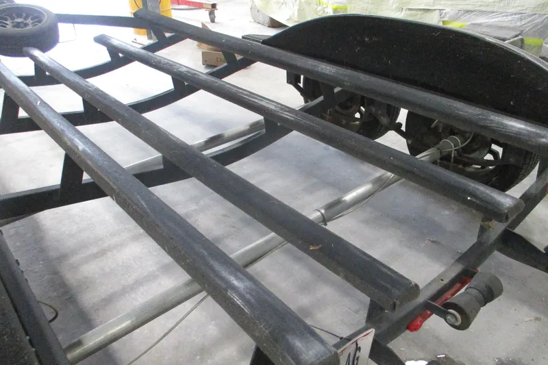 Slide: The Image of 2024 Nitro Z20 boat trailer frame with visible axles and support beams. - 16