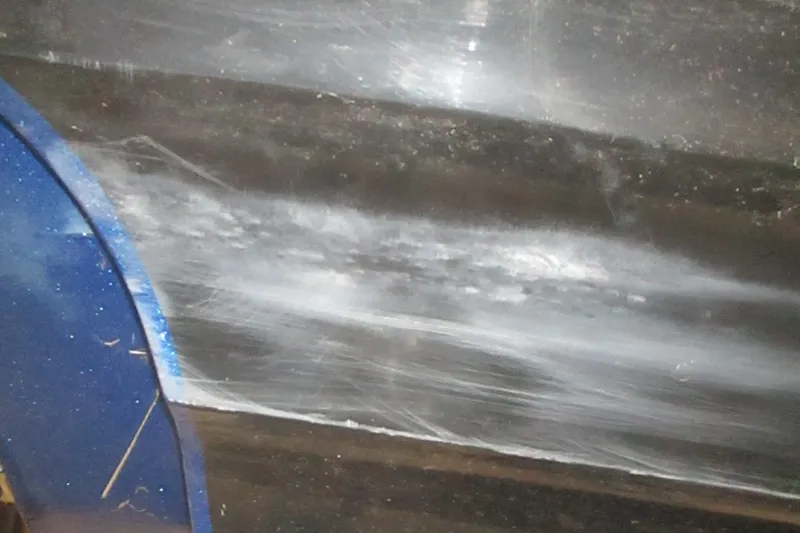 Slide: The Image of Close-up of a scratched blue and silver surface on a 2024 Nitro Z20. - 18