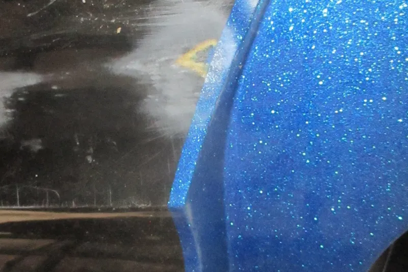 Slide: The Image of Close-up of a 2024 Nitro Z20 with sparkling blue paint detail. - 19