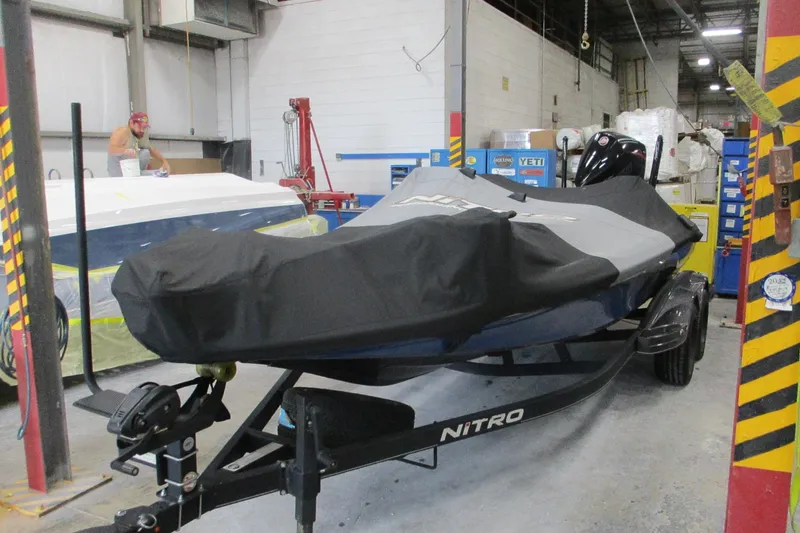 Slide: The Image of 2024 Nitro Z20 boat covered in a workshop setting. - 4