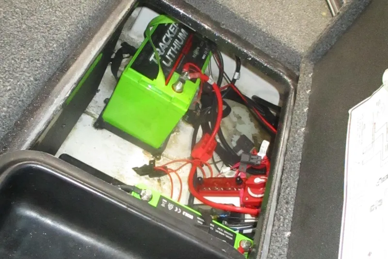 Slide: The Image of 2024 Nitro Z20 battery compartment with Tracker Lithium battery and wiring. - 7