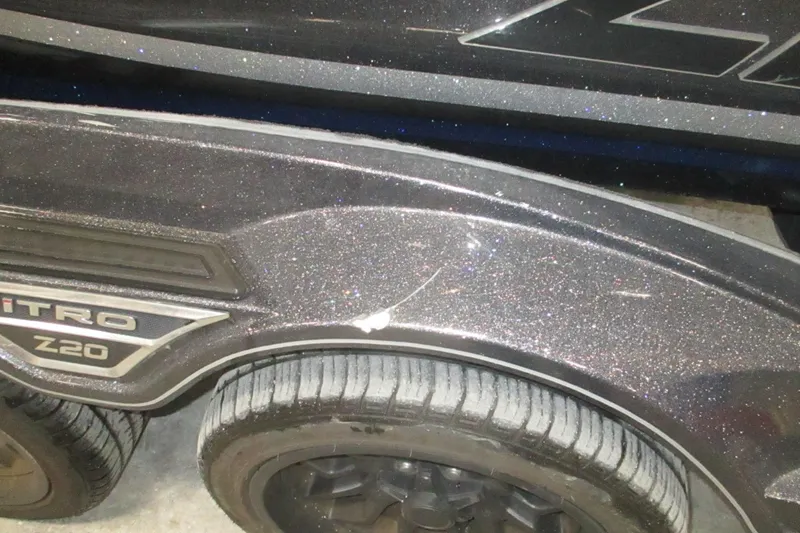 Slide: The Image of 2024 Nitro Z20 boat trailer with metallic finish and visible tire detail. - 9