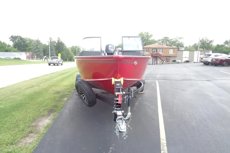 Slide: The Image of 2026 Lund 1800 Explorer Sport boat on trailer in parking lot. - 10