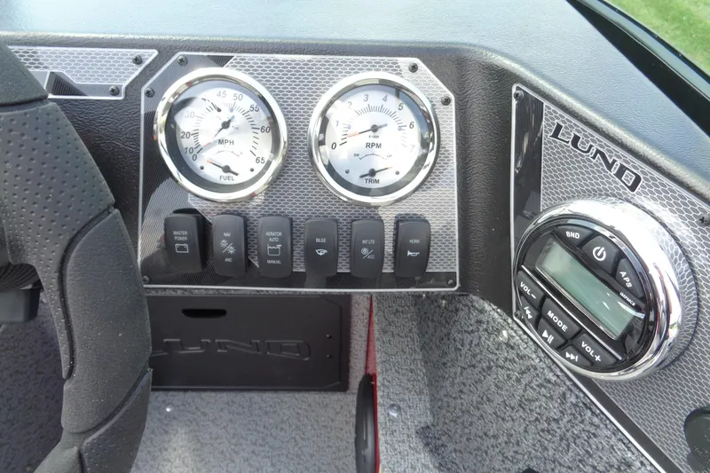Slide: The Image of Dashboard of 2026 Lund 1800 Explorer Sport boat with gauges and controls. - 15