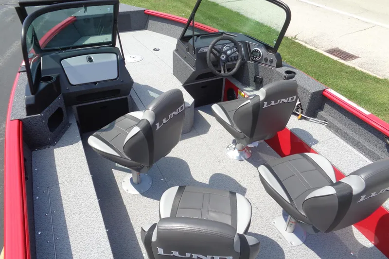Slide: The Image of 2026 Lund 1800 Explorer Sport boat interior with four seats and steering console. - 27